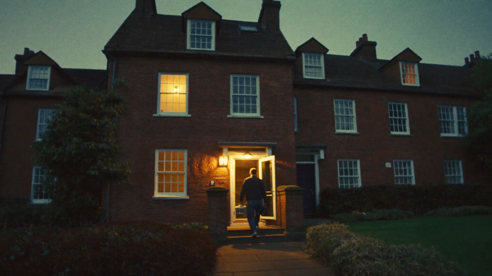 An Irish tradesperson arriving at a customer's door at dusk